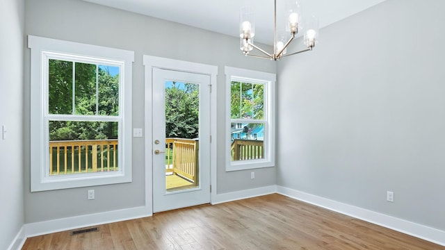 570 Main St S, Ashland City, TN 37015 - doorway featuring a chandelier, plenty of natural light, and wood finished floors