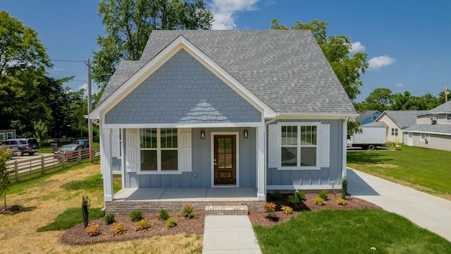 570 Main St S, Ashland City, TN 37015 - view of front of house with board and batten siding, a porch, and roof with shingles
