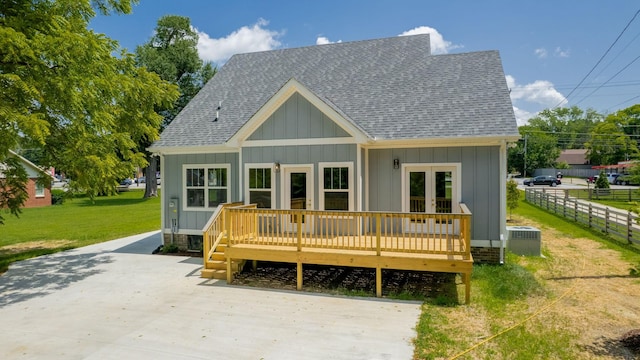 570 Main St S, Ashland City, TN 37015 - view of front of property featuring french doors, board and batten siding, roof with shingles, and a deck