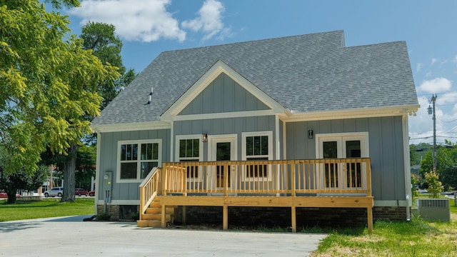570 Main St S, Ashland City, TN 37015 - rear view of house featuring roof with shingles, board and batten siding, and a deck