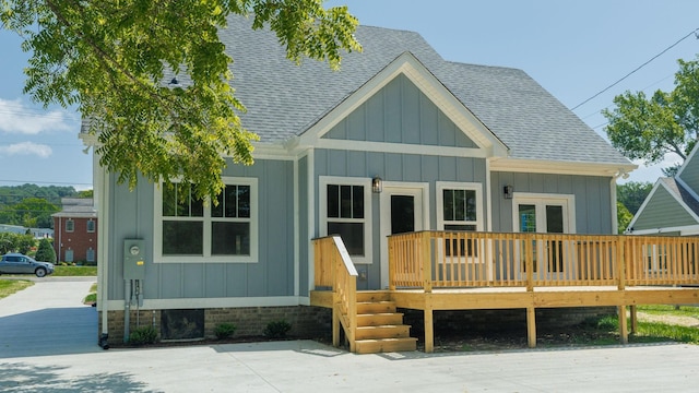 570 Main St S, Ashland City, TN 37015 - view of front of home featuring roof with shingles, board and batten siding, and a deck