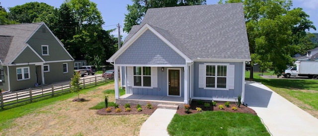 570 Main St S, Ashland City, TN 37015 - bungalow-style house featuring board and batten siding, covered porch, and roof with shingles