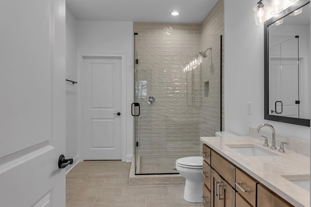 418 Stonemeadow Rd, Clarksville, TN 37043 - bathroom with double vanity, a shower stall, tile patterned flooring, and recessed lighting