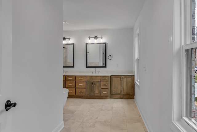 418 Stonemeadow Rd, Clarksville, TN 37043 - full bathroom featuring vanity, healthy amount of natural light, and a freestanding tub