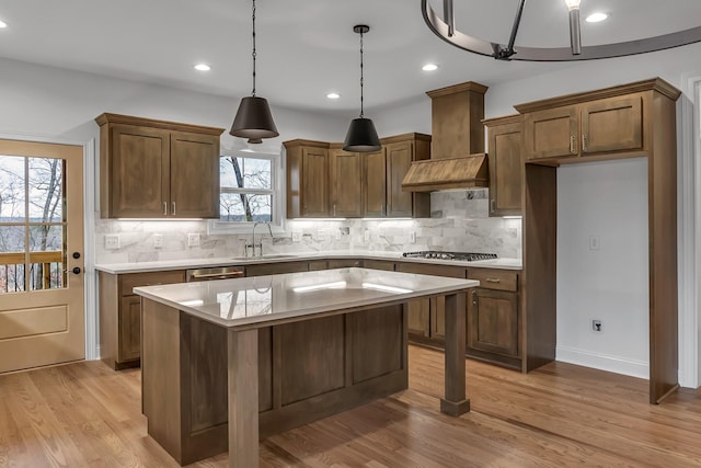 418 Stonemeadow Rd, Clarksville, TN 37043 - kitchen with stainless steel appliances, premium range hood, backsplash, light countertops, and recessed lighting
