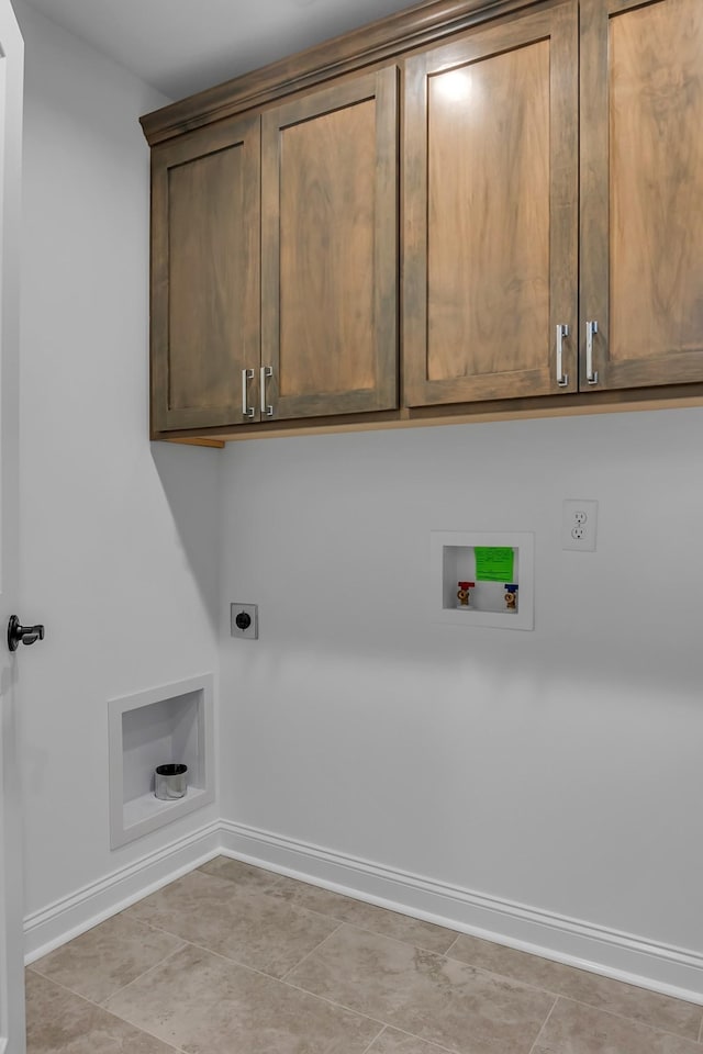 418 Stonemeadow Rd, Clarksville, TN 37043 - washroom with hookup for an electric dryer, cabinet space, hookup for a washing machine, and light tile patterned floors