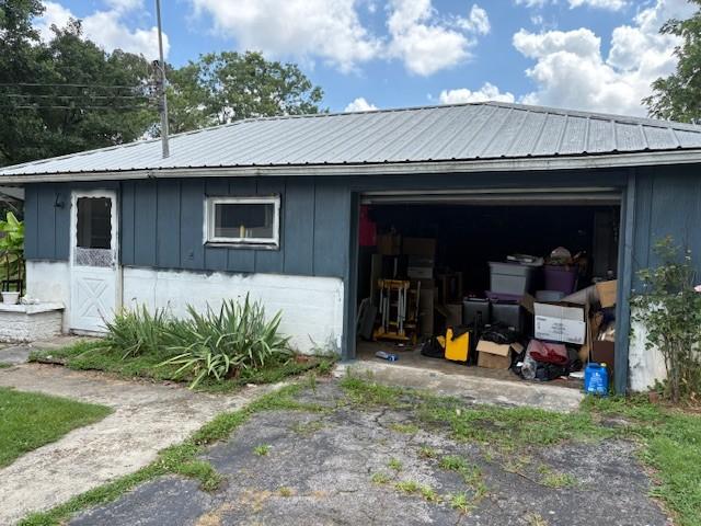 102 Thorogood St, Cowan, TN 37318 - exterior space with a garage