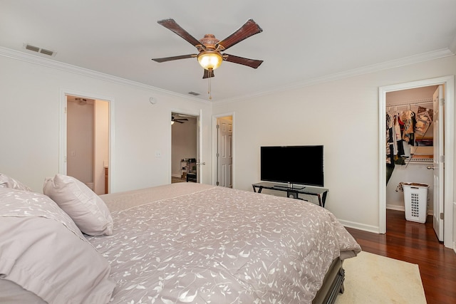 4817 Laura Jeanne Blvd, Murfreesboro, TN 37129 - bedroom with a spacious closet, crown molding, dark wood-style flooring, and a ceiling fan