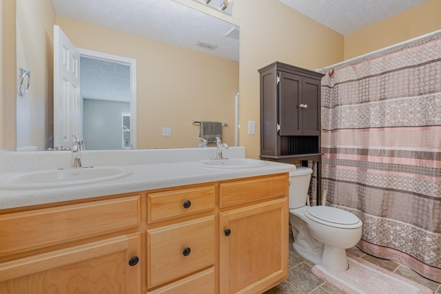 4817 Laura Jeanne Blvd, Murfreesboro, TN 37129 - bathroom featuring a textured ceiling, double vanity, tile patterned flooring, and curtained shower