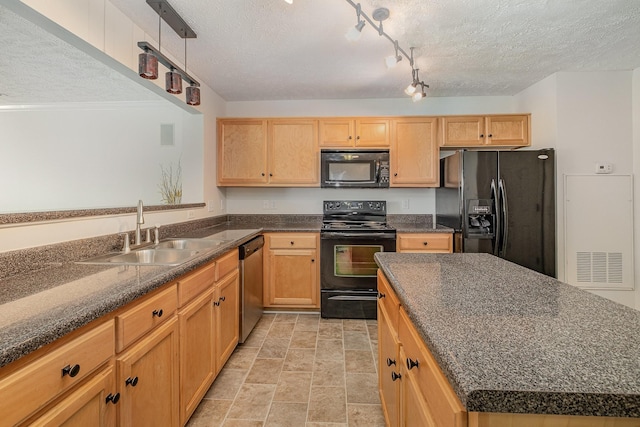 4817 Laura Jeanne Blvd, Murfreesboro, TN 37129 - kitchen with a textured ceiling, black appliances, dark stone countertops, a center island, and light stone finish floors