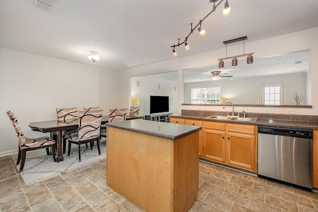 4817 Laura Jeanne Blvd, Murfreesboro, TN 37129 - kitchen featuring dishwasher, a center island, a ceiling fan, stone finish floors, and a textured ceiling
