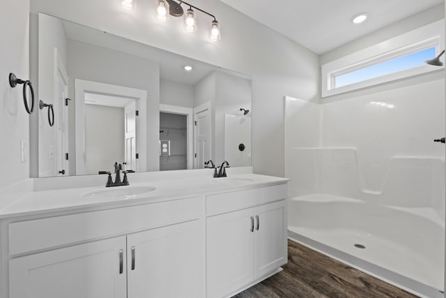 15 Aurora Cir, Fayetteville, TN 37334 - bathroom featuring double vanity, wood finished floors, a shower, and recessed lighting