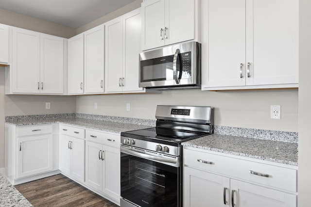 15 Aurora Cir, Fayetteville, TN 37334 - kitchen with stainless steel appliances, white cabinets, dark wood-type flooring, and light stone countertops