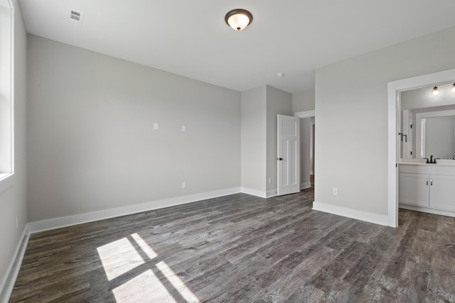 15 Aurora Cir, Fayetteville, TN 37334 - unfurnished bedroom featuring dark wood-style floors and connected bathroom