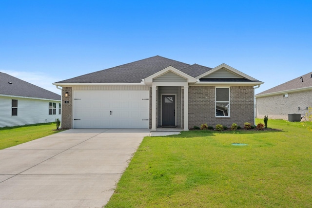 15 Aurora Cir, Fayetteville, TN 37334 - single story home featuring brick siding, a front lawn, concrete driveway, and an attached garage