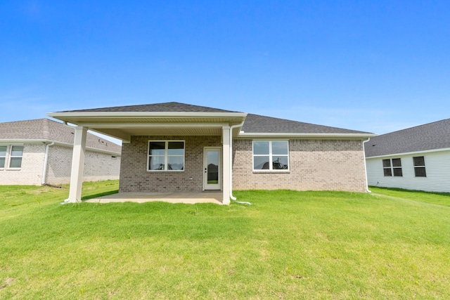 15 Aurora Cir, Fayetteville, TN 37334 - back of house with a patio area, a lawn, and brick siding