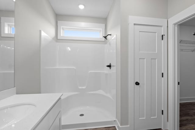 15 Aurora Cir, Fayetteville, TN 37334 - bathroom with vanity, a shower, and a walk in closet