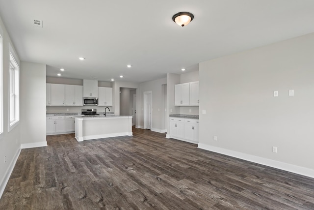 15 Aurora Cir, Fayetteville, TN 37334 - unfurnished living room with dark wood-type flooring and recessed lighting