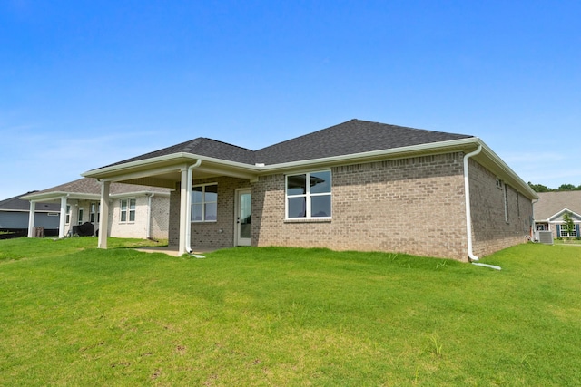 15 Aurora Cir, Fayetteville, TN 37334 - back of property with a yard and brick siding