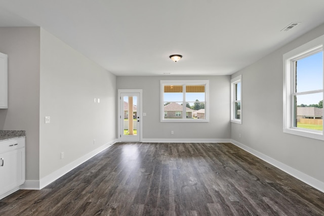 15 Aurora Cir, Fayetteville, TN 37334 - unfurnished living room with dark wood-style flooring and baseboards