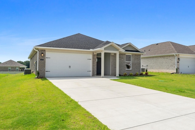 15 Aurora Cir, Fayetteville, TN 37334 - view of front of home with an attached garage, concrete driveway, brick siding, a front yard, and a shingled roof