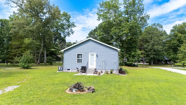 332 Riddle Ln, Estill Springs, TN 37330 - view of home's exterior featuring entry steps, a lawn, a fire pit, and crawl space