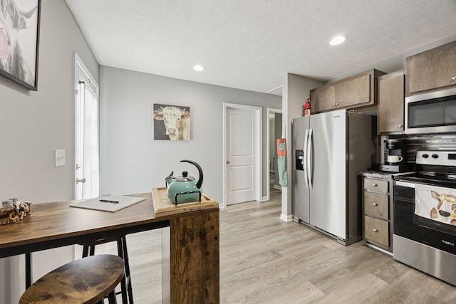 332 Riddle Ln, Estill Springs, TN 37330 - kitchen with stainless steel appliances, light wood-style flooring, and recessed lighting