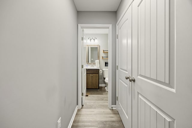 332 Riddle Ln, Estill Springs, TN 37330 - corridor with light wood-type flooring and a sink
