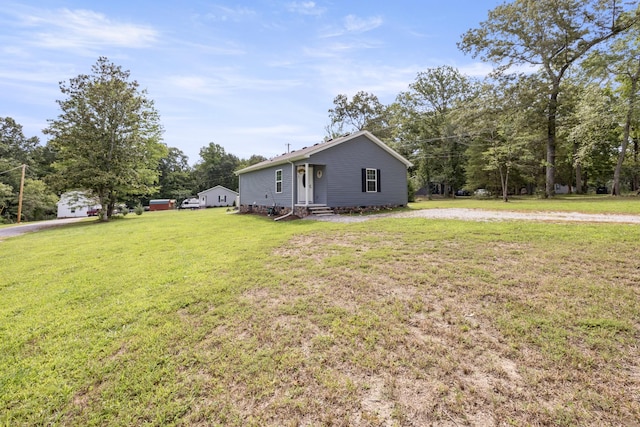 332 Riddle Ln, Estill Springs, TN 37330 - view of property exterior featuring entry steps, a yard, and view of wooded area