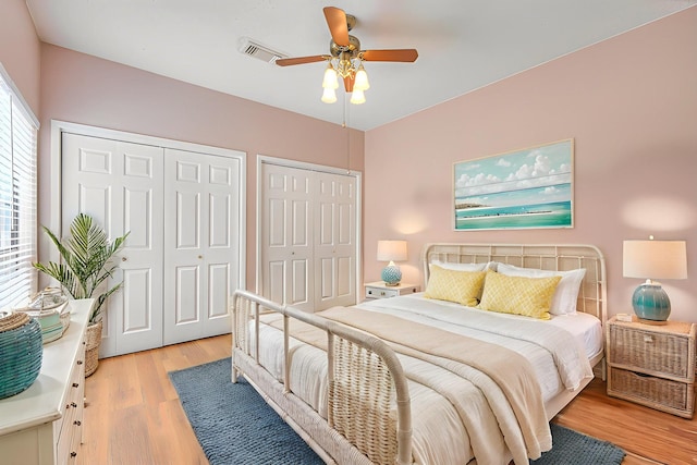 302 Laurel Hill Dr, Old Hickory, TN 37138 - bedroom with two closets, light wood-type flooring, and a ceiling fan