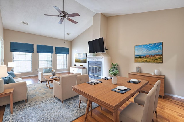 302 Laurel Hill Dr, Old Hickory, TN 37138 - living area with light wood-style flooring, a glass covered fireplace, high vaulted ceiling, and ceiling fan