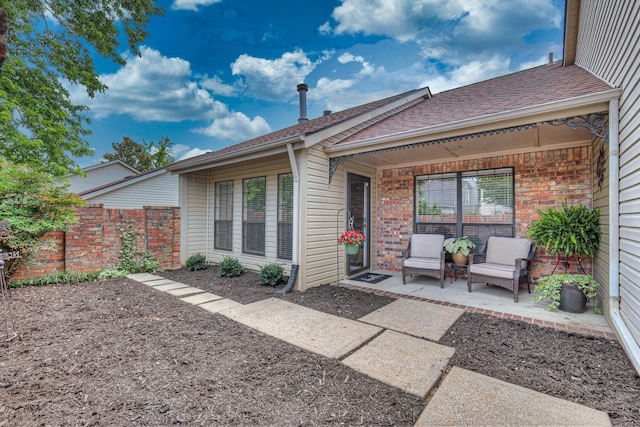302 Laurel Hill Dr, Old Hickory, TN 37138 - back of property featuring a patio, roof with shingles, and brick siding