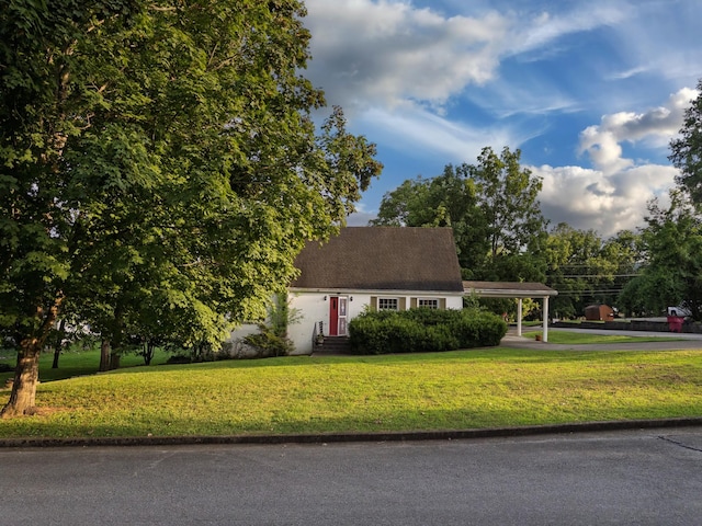 204 Fisher Ave, Carthage, TN 37030 - view of front of house with a carport, driveway, a front lawn, and entry steps