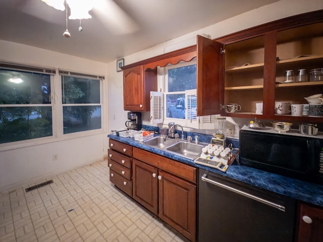 204 Fisher Ave, Carthage, TN 37030 - kitchen with dishwasher, brick patterned floors, dark countertops, open shelves, and brown cabinetry