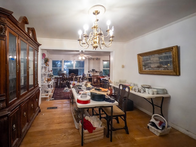 204 Fisher Ave, Carthage, TN 37030 - dining area featuring a chandelier, a ceiling fan, and light wood-type flooring