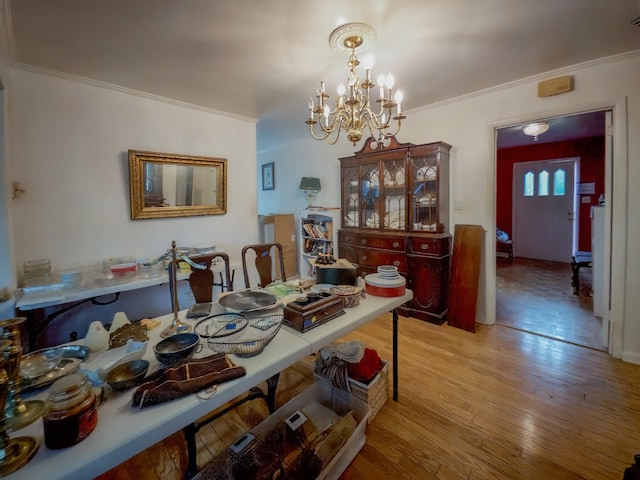 204 Fisher Ave, Carthage, TN 37030 - dining room featuring crown molding, light wood-style flooring, and a chandelier