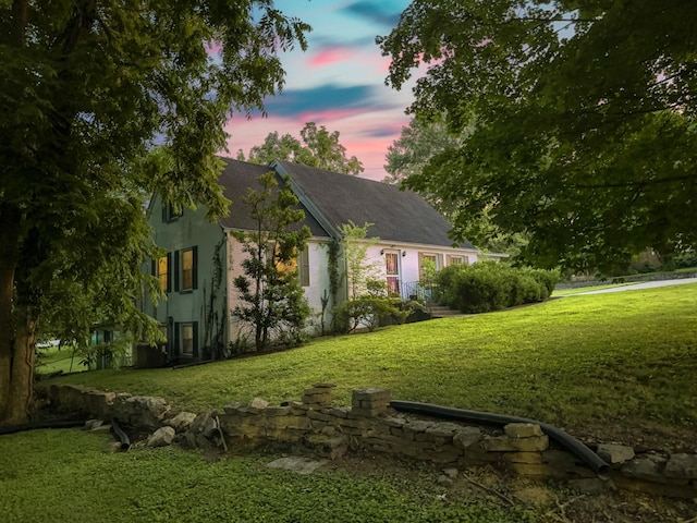 204 Fisher Ave, Carthage, TN 37030 - view of side of home with a yard, stucco siding, and a shingled roof