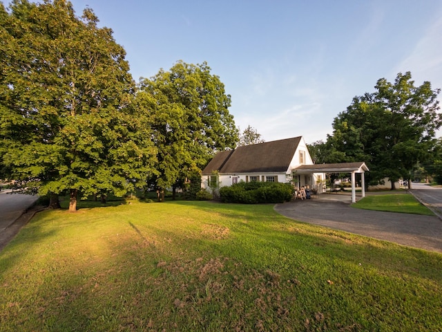 204 Fisher Ave, Carthage, TN 37030 - view of front of house with a front yard, asphalt driveway, and an attached carport