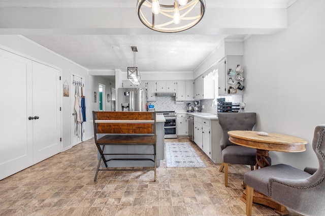 3506 New Windsor Ct, Antioch, TN 37013 - kitchen with appliances with stainless steel finishes, tasteful backsplash, a kitchen island, light countertops, and stone finish floors