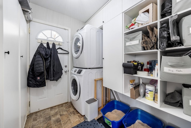 3506 New Windsor Ct, Antioch, TN 37013 - washroom featuring stacked washer / dryer and stone finish flooring