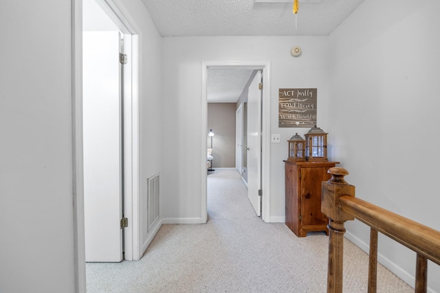 3506 New Windsor Ct, Antioch, TN 37013 - hallway with a textured ceiling, carpet flooring, and attic access