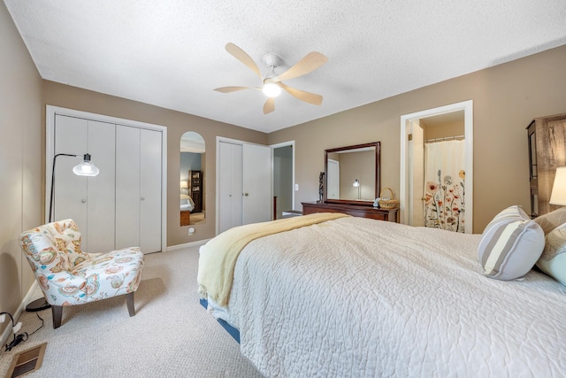 3506 New Windsor Ct, Antioch, TN 37013 - bedroom with two closets, carpet flooring, a ceiling fan, and a textured ceiling