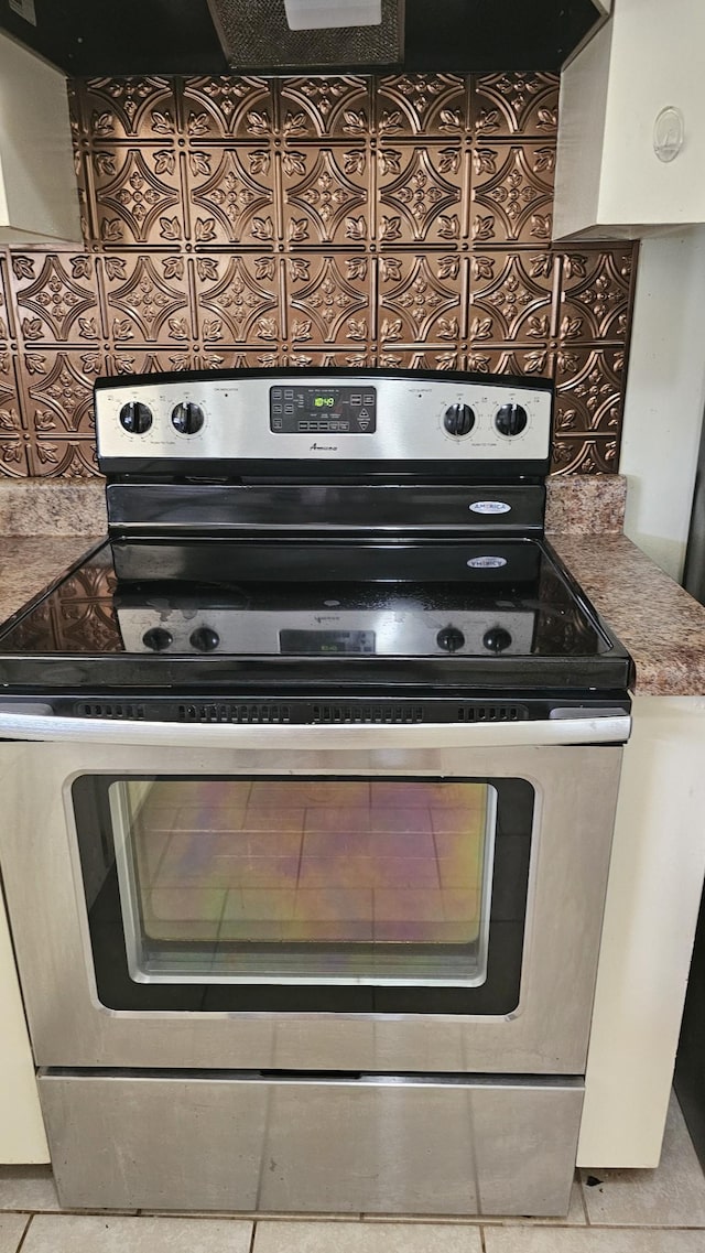 1949 Timberline Cir, Oak Grove, KY 42262 - kitchen view of stainless steel range with electric stovetop and tasteful backsplash