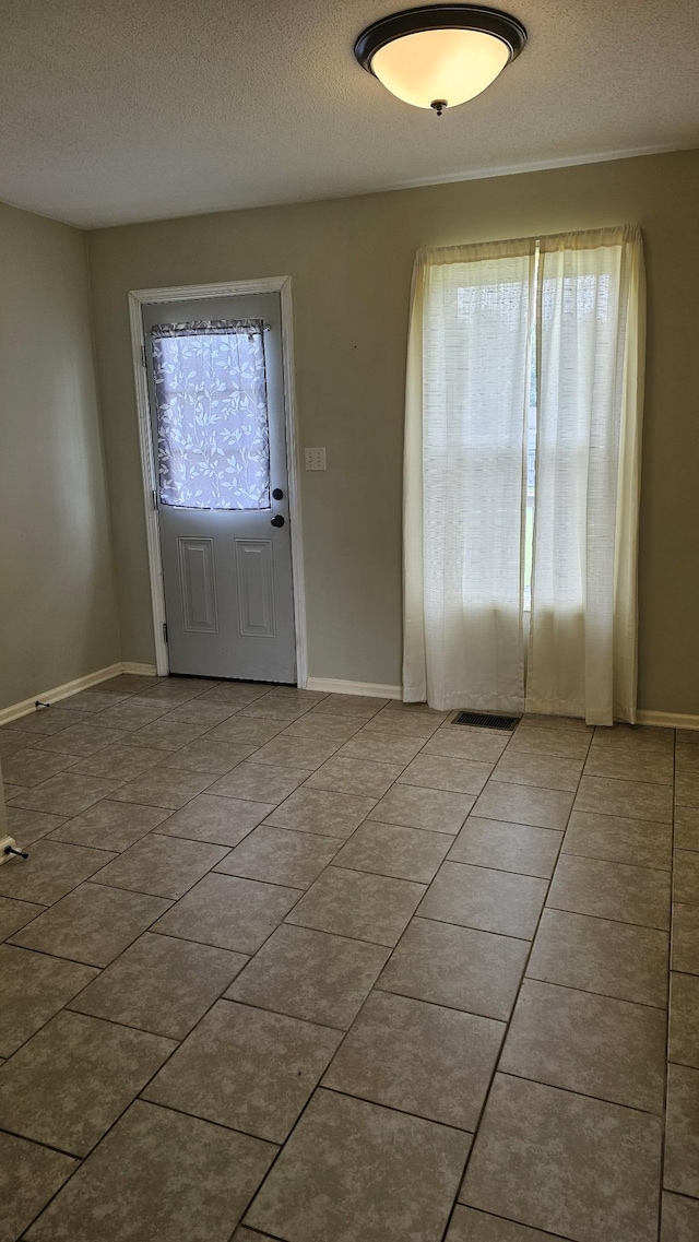 1949 Timberline Cir, Oak Grove, KY 42262 - tiled foyer with healthy amount of natural light and a textured ceiling