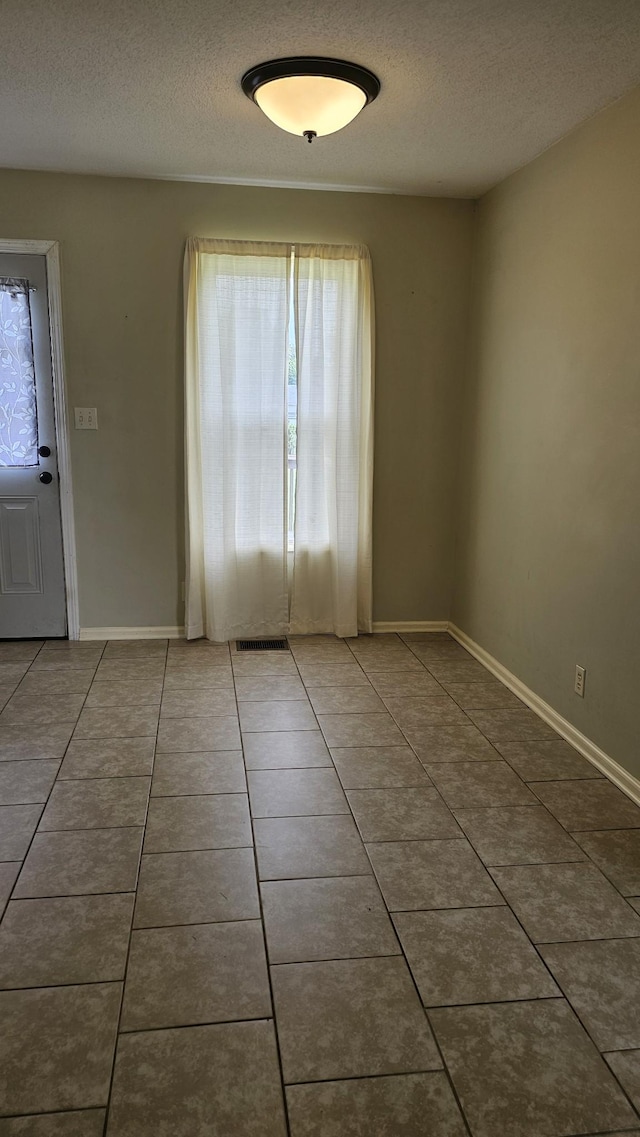 1949 Timberline Cir, Oak Grove, KY 42262 - tiled spare room with a textured ceiling