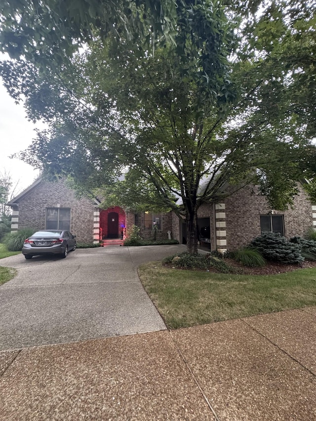 238 Mclean Ct, Franklin, TN 37067 - obstructed view of property featuring driveway and brick siding