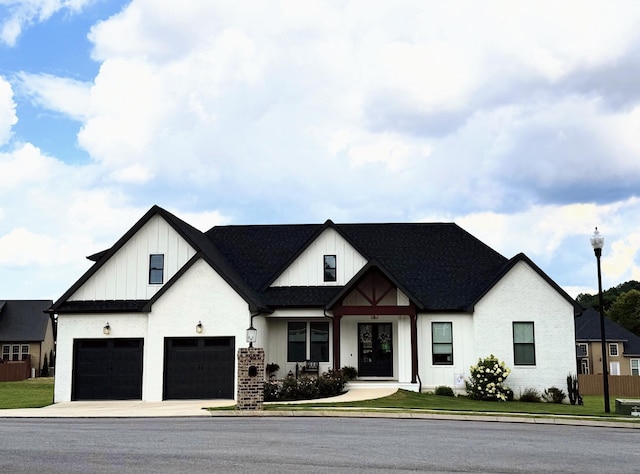 151 Red Fox Ln NW, Cleveland, TN 37312 - modern inspired farmhouse featuring concrete driveway, a front yard, and board and batten siding