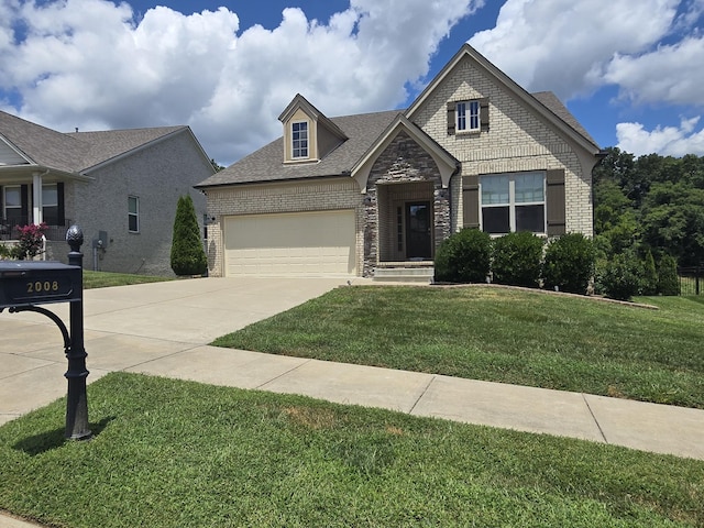 2008 Hedgelawn Dr, Lebanon, TN 37090 - craftsman-style house with brick siding, concrete driveway, a front yard, a garage, and a shingled roof