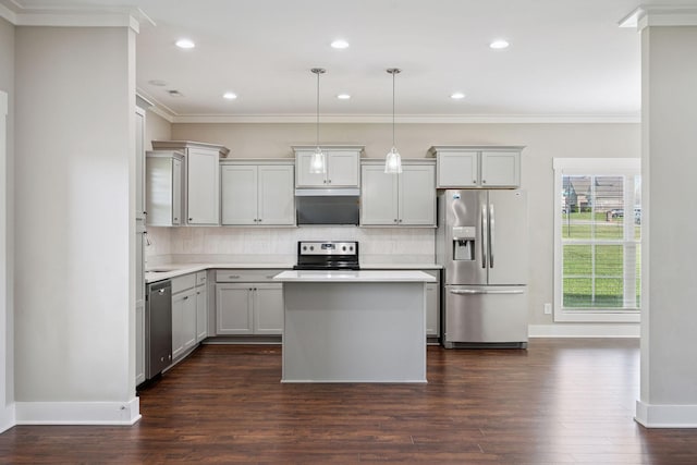 1412 Wrangler Ln, Smyrna, TN 37167 - kitchen with appliances with stainless steel finishes, crown molding, light countertops, decorative backsplash, and dark wood-style flooring