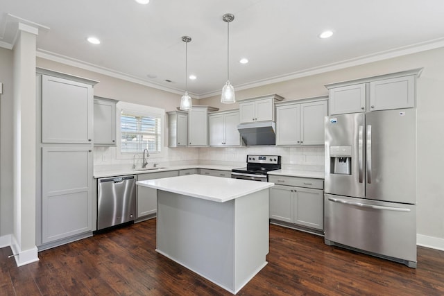 1412 Wrangler Ln, Smyrna, TN 37167 - kitchen featuring stainless steel appliances, gray cabinets, under cabinet range hood, backsplash, and crown molding